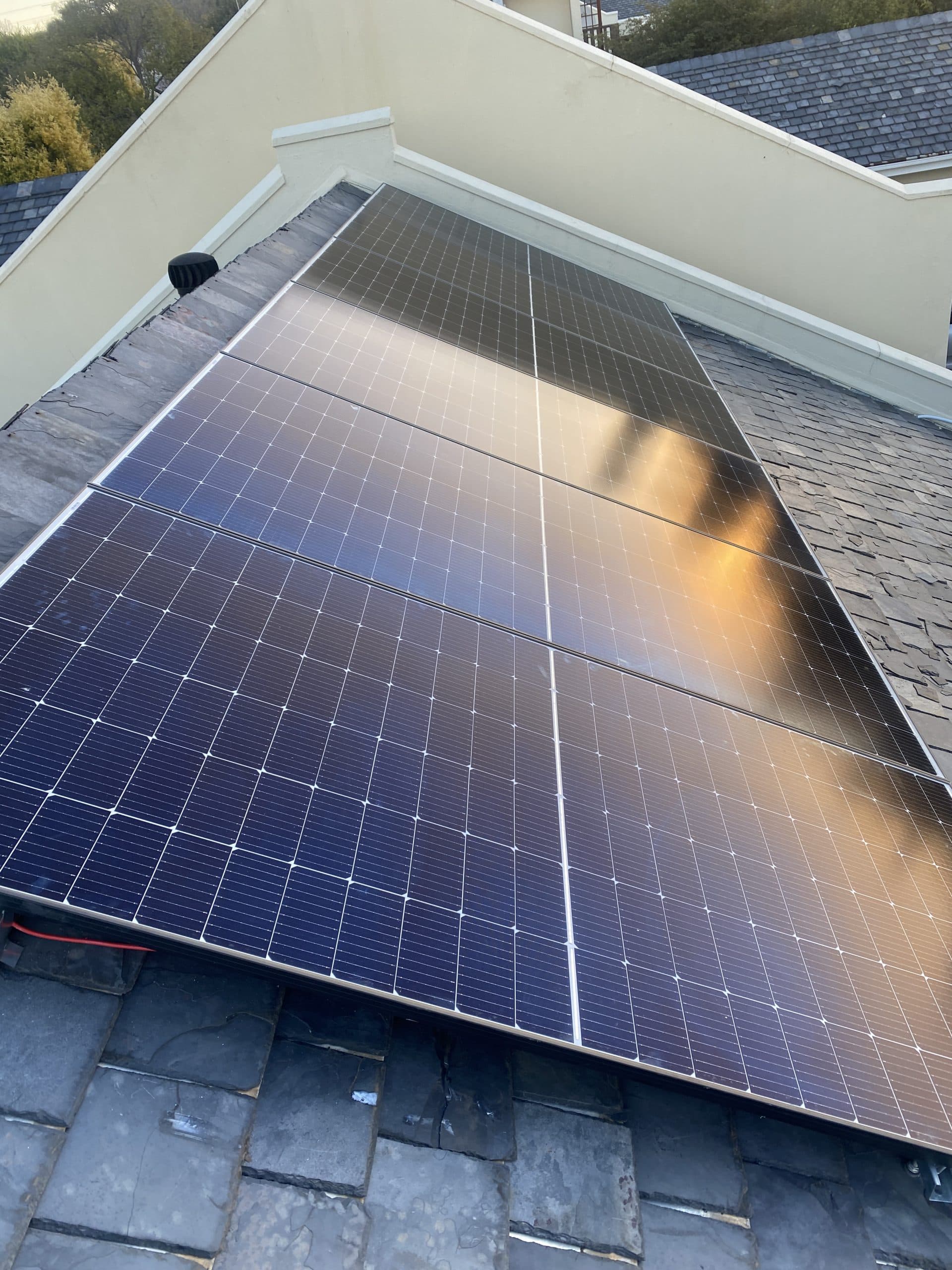 Solar panels installed across a rooftop.