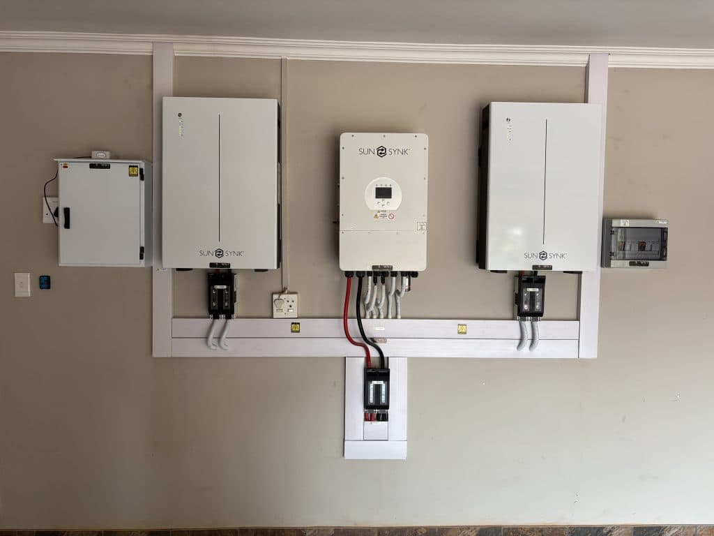 Wall-mounted hybrid inverter with electrical protection equipment.