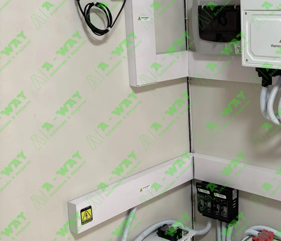 Wall-mounted solar inverter and electrical protection equipment.